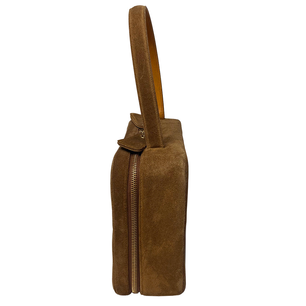 Chanel tobacco suede vanity case by Karl Lagerfeld for Chanel 1997-1999. Rectangular top handle bag with interlocking stitched CC logo at front, dual suede paddle zipper pull closure, chocolate leather interior with one zippered pocket and one slip pocket. Serial number sticker attached. Made in Italy