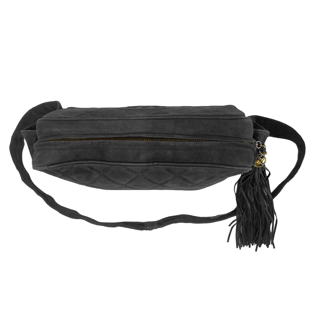 Chanel quilted CC logo crossbody charcoal grey shoulder bag with suede strap by Karl Lagerfeld for Chanel, 1995 with etched gold ball and tassels zipper pull, outer flap pocket with black leather lining, interior zippered pocket. Made in France