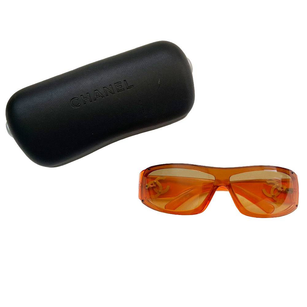 Chanel Translucent Orange Frame CC Logo Sunglasses. Curved rectangular acetate frame with prominent CC gold-tone logo at each arm. Brown gradient lens Style: 5072 Hard case included Excellent condition, very minimal scratches on lens, case in good condition Made in Italy