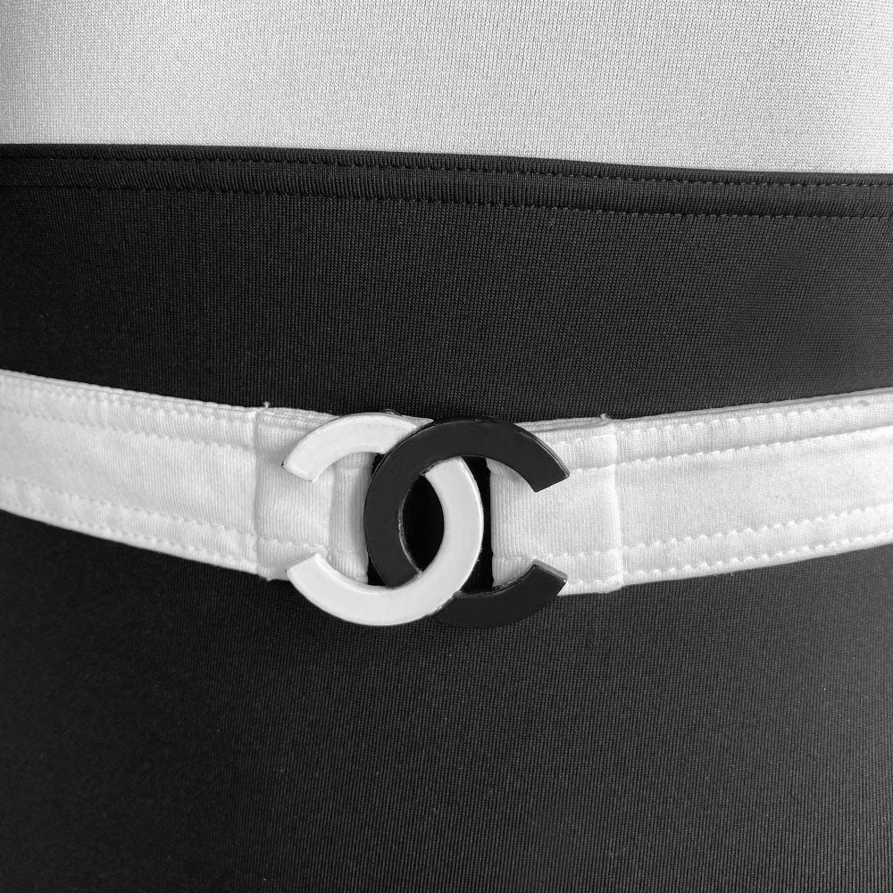 Chanel colorblock black and white belted one piece swimsuit by Karl Lagerfeld for Chanel 2003 Cruise Collection. Double layered backless tank style bodice with removable belt with interlocking CC enamel coated metal clasp closure. Made in France