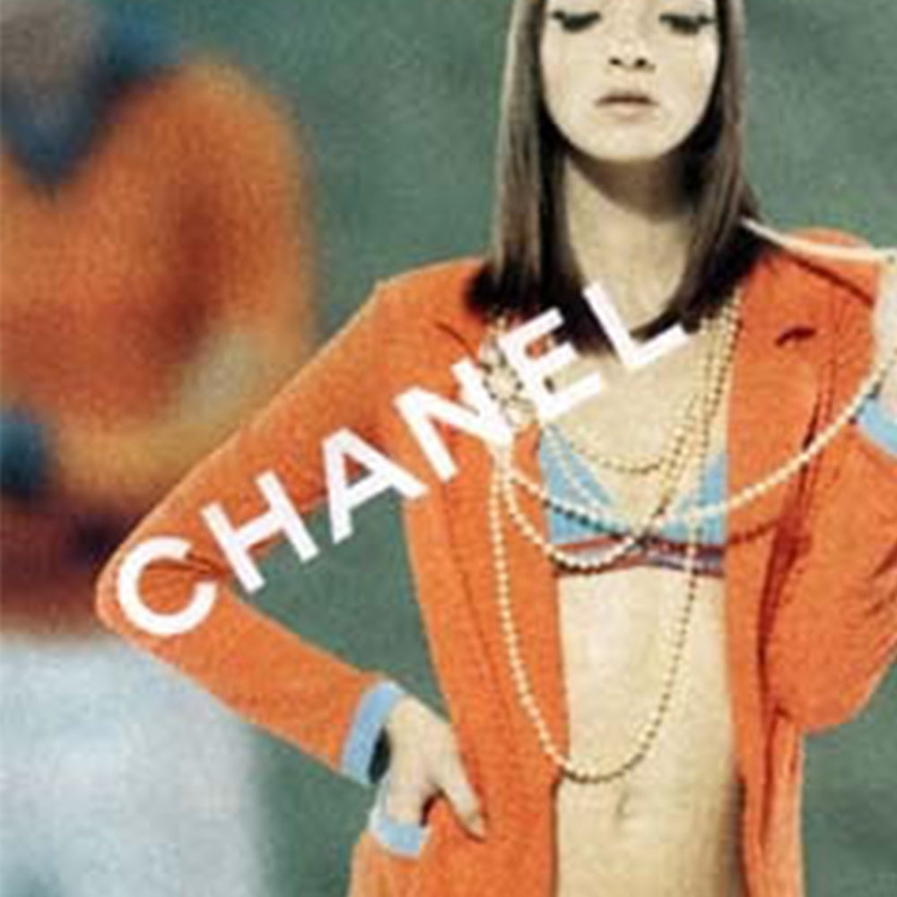 Chanel monogram terrycloth blazer by Karl Lagerfeld for Chanel S/S 2002 with long sleeves, all over boxed CC logo pattern, notched lapel, single logo silver-tone front snap button closure and 2 front patch pockets. Tangerine orange with turquoise accent. Made in France