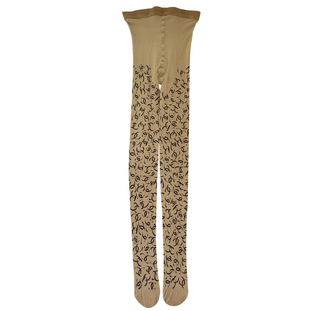 Chanel ribbon CC logo tights, fall 2000 RTW runway by Karl Lagerfeld for Chanel in neutral beige color "patterned fancy tights” with all over ribbon design black CC logos, interlocking CC logos at waistband, cotton gusset, reinforced toes. Made in France