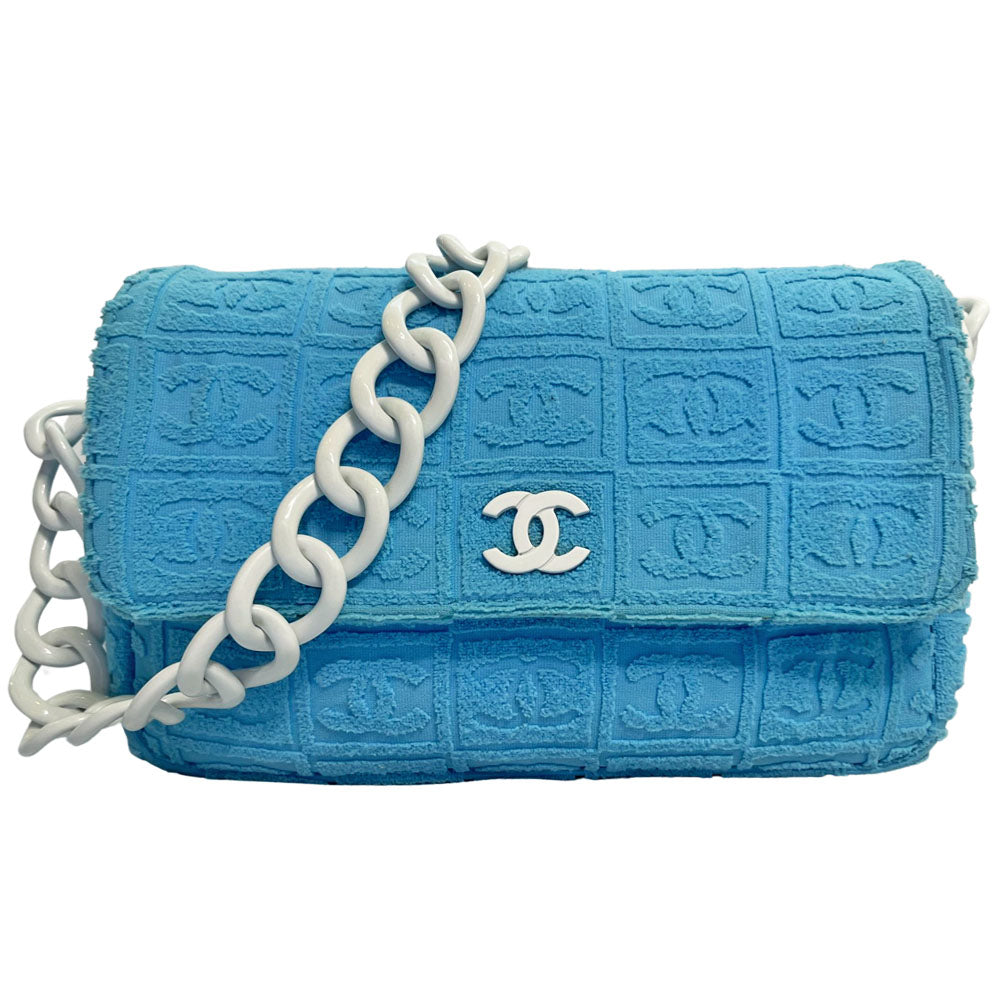Chanel sky blue blue terry towel flap bag Karl Lagerfeld for Chanel 2002 with all over boxed cc logo embossed terry cloth flap bag with bold white acrylic chain strap, white cc front logo at flap, white zipper closure, white leather lining with one pvc pocket and 1 slip pocket. Made in Italy