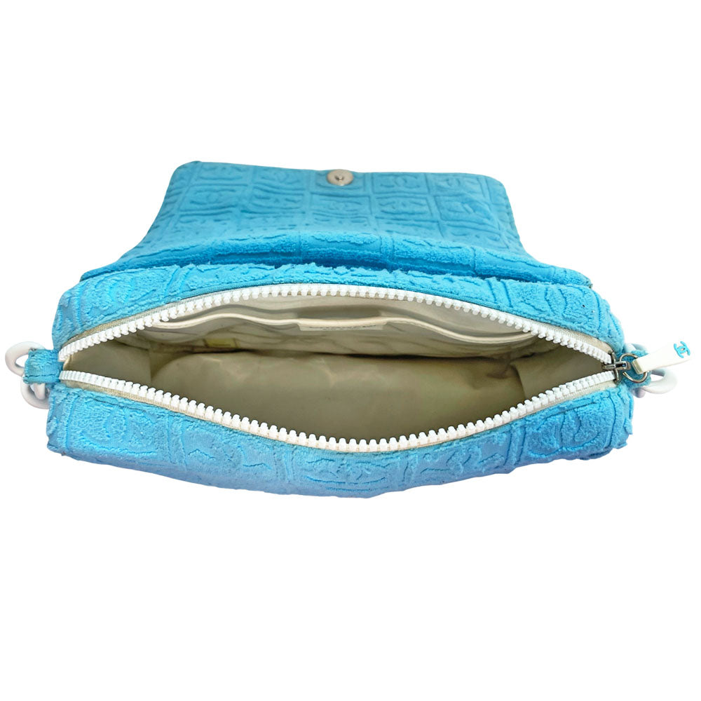 Chanel sky blue blue terry towel flap bag Karl Lagerfeld for Chanel 2002 with all over boxed cc logo embossed terry cloth flap bag with bold white acrylic chain strap, white cc front logo at flap, white zipper closure, white leather lining with one pvc pocket and 1 slip pocket. Made in Italy
