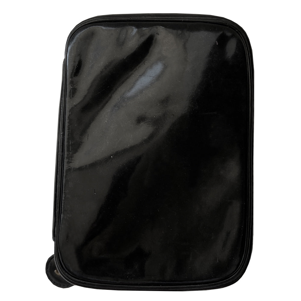 Chanel black patent leather vanity case by Karl Lagerfeld for Chanel 1996-1997 Rectangular bag with stitched interlocking CC logo at front, top handle, zip around closure with leather disc zipper pull embellished with gold CC logo. Leather interior with inner slip pocket pouch, Chanel stamped inside. Made in Italy