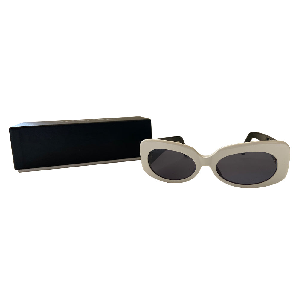 Chanel Black & White acetate frame sunglasses from Spring 1995 by Karl Lagerfeld for Chanel RTW runway. Butterfly style white frames with thick black side arms and charcoal lenses Interlocking gold-tone inset CC logos at each arm Style: 05252 C0200. Made in Italy