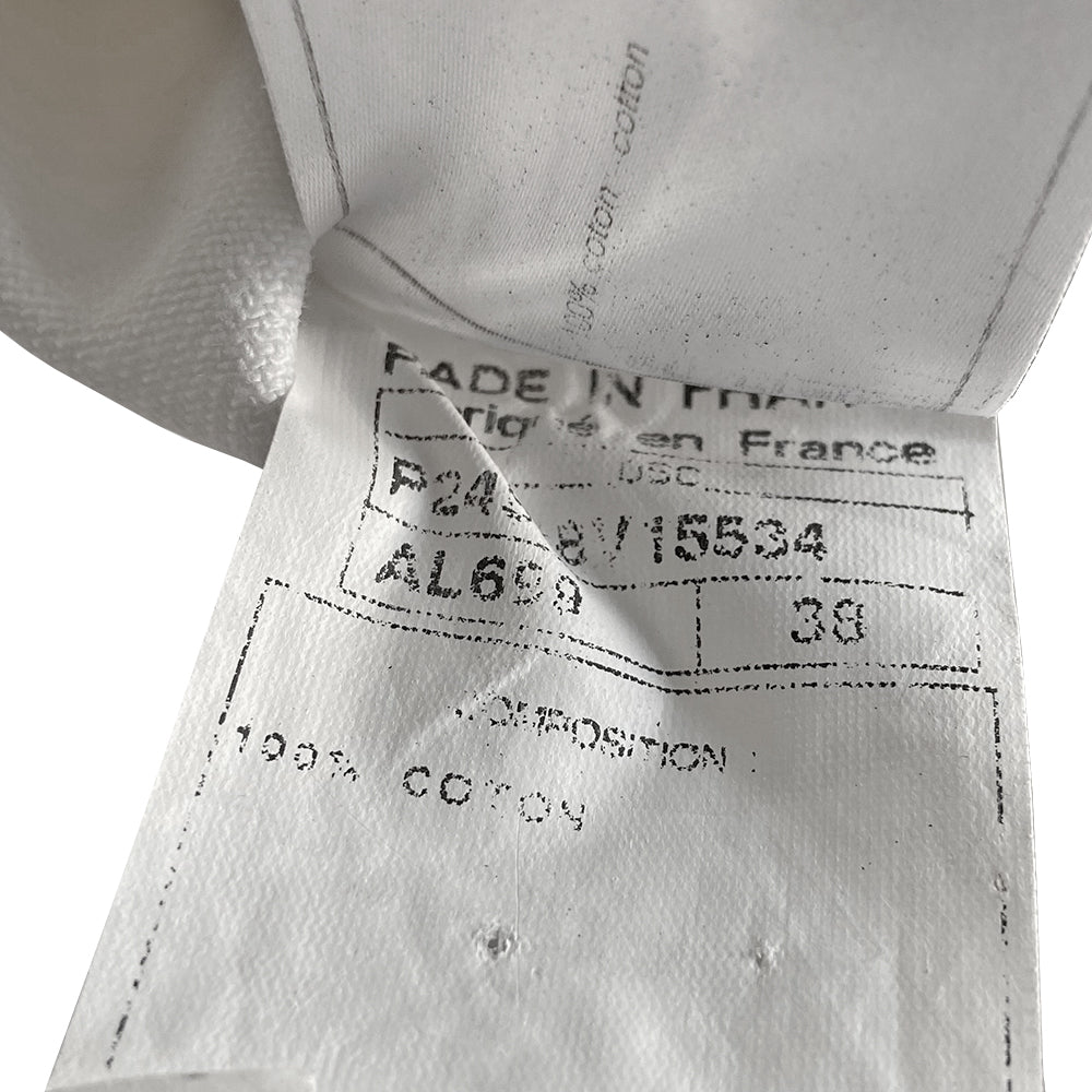 Chanel CC logo white canvas zip jacket by Karl Lagerfeld for Chanel, Cruise 2005 with accent stitching, brown and white striped knit accents, vented detail at sleeve hems. White CC logo zipper pull and white rubber box CC logo appliqué on arm. 100% Cotton