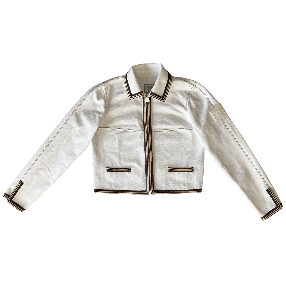 Chanel CC logo white canvas zip jacket by Karl Lagerfeld for Chanel, Cruise 2005 with accent stitching, brown and white striped knit accents, vented detail at sleeve hems. White CC logo zipper pull and white rubber box CC logo appliqué on arm. 100% Cotton