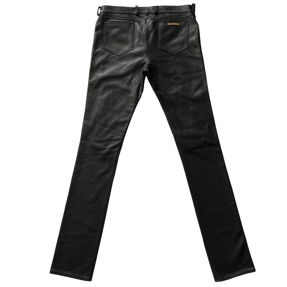 Custom-made unused black leather pants by Chrome Hearts, Los Angeles Front CH appliqué fleur du lis patch at front knees. 5 cross patches, Chrome Hearts jacquard silk lining, 5 sterling silver fly buttons. Three front pockets with sterling grommets, back pocket with sterling Chrome Hearts banner, Interior leather Chrome Hearts USA banner embossed patch.