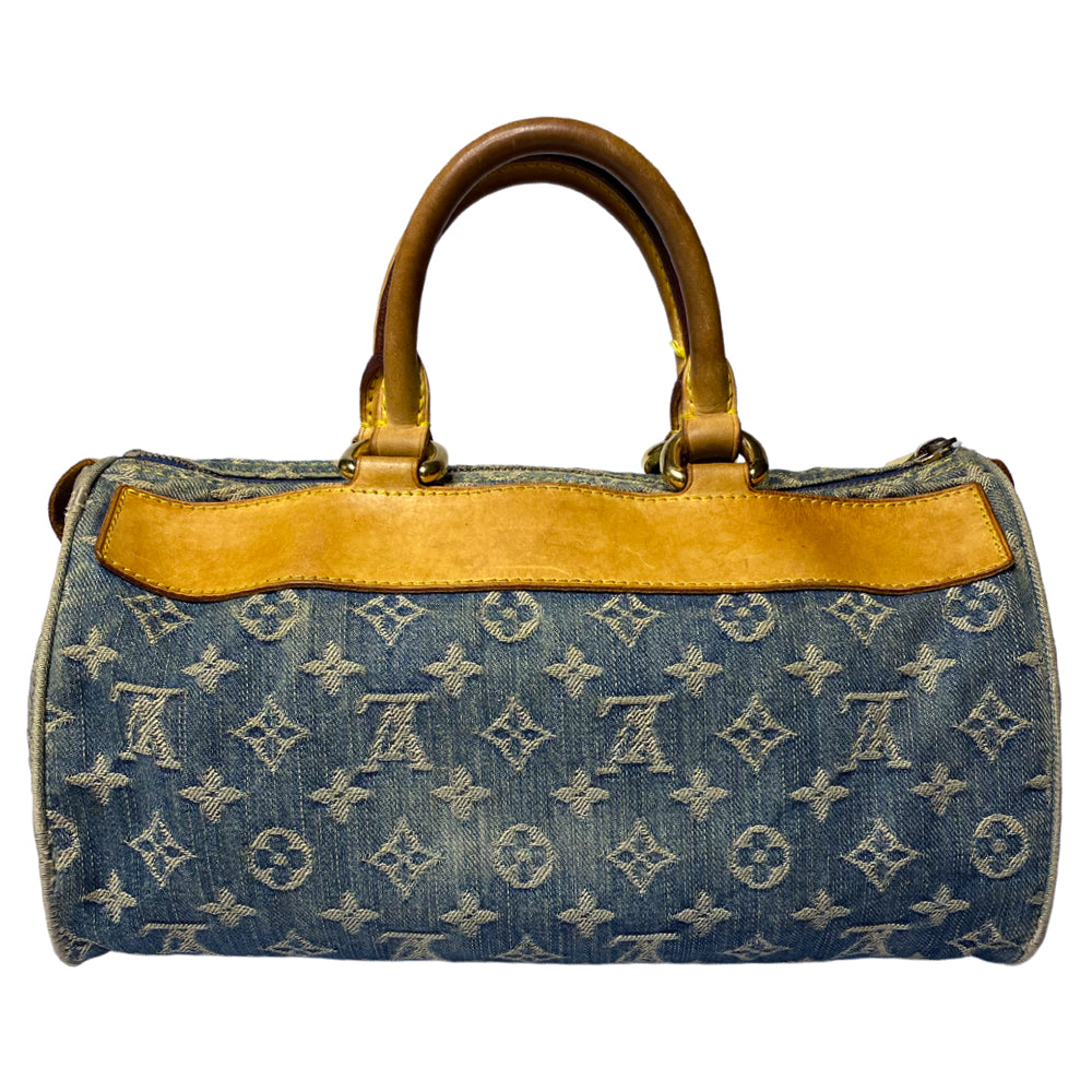 Louis Vuitton monogram blue denim neo speedy by Marc Jacobs for Louis Vuitton, 2005 with 2 outer front pockets with gold-tone push lock closures and hardware. Vachetta leather trimmed exterior, zippered outer pocket, 2 rolled leather handles. Top zip closure opens to alcantara lining with one interior slip pocket. Made in France