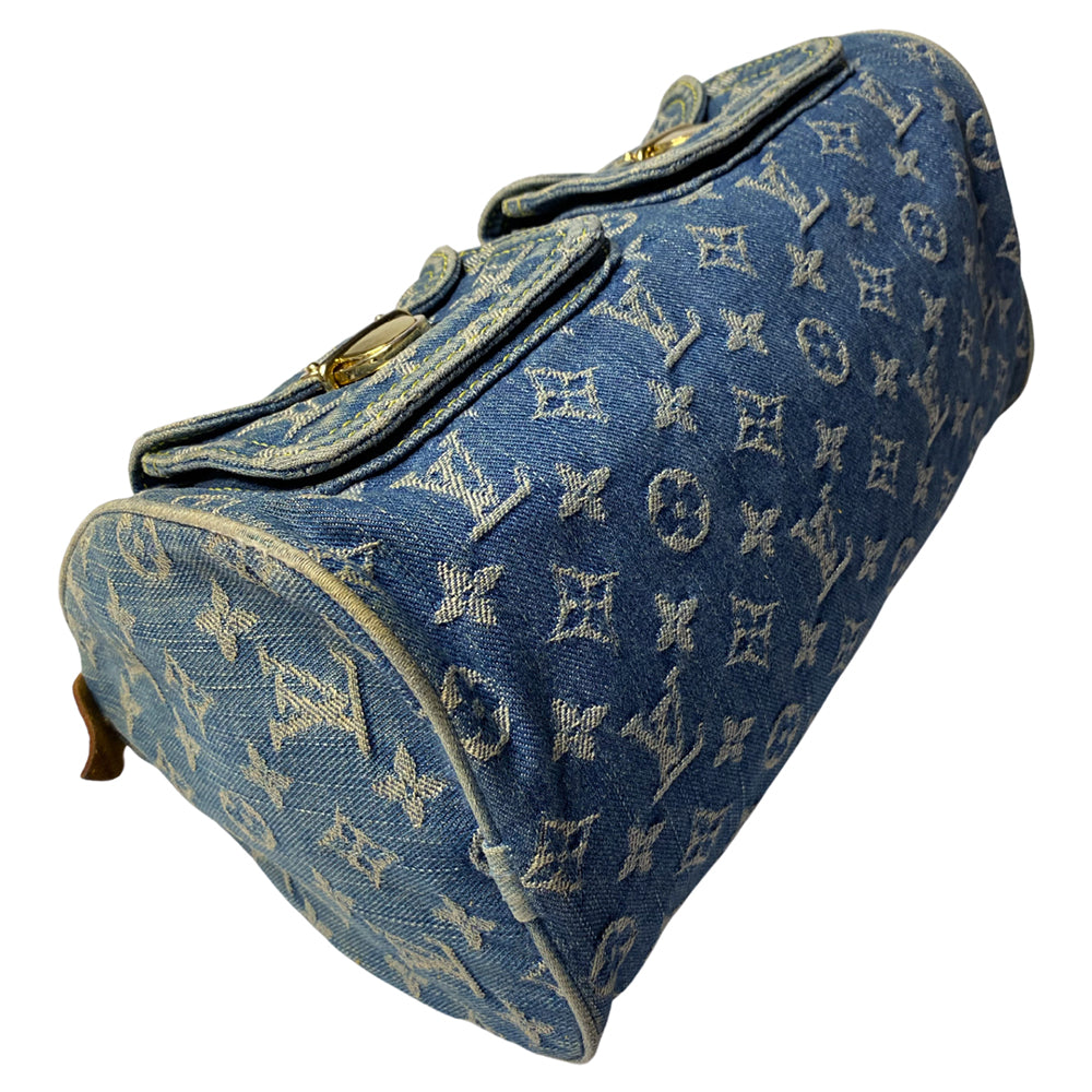 Louis Vuitton monogram blue denim neo speedy by Marc Jacobs for Louis Vuitton, 2005 with 2 outer front pockets with gold-tone push lock closures and hardware. Vachetta leather trimmed exterior, zippered outer pocket, 2 rolled leather handles. Top zip closure opens to alcantara lining with one interior slip pocket. Made in France