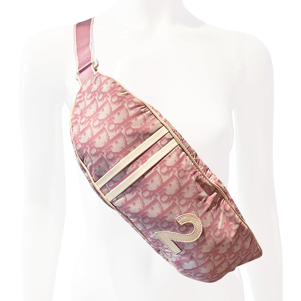 Christian Dior pink monogram canvas waist pouch John Galliano for Dior, 2004 with white patent leather appliqué No 2, dual front stripes and piping. Pink with white edge satin webbing adjustable belt with white plastic logo clip closure. Pink textile lined interior, two rear zip pocket. Made in Spain