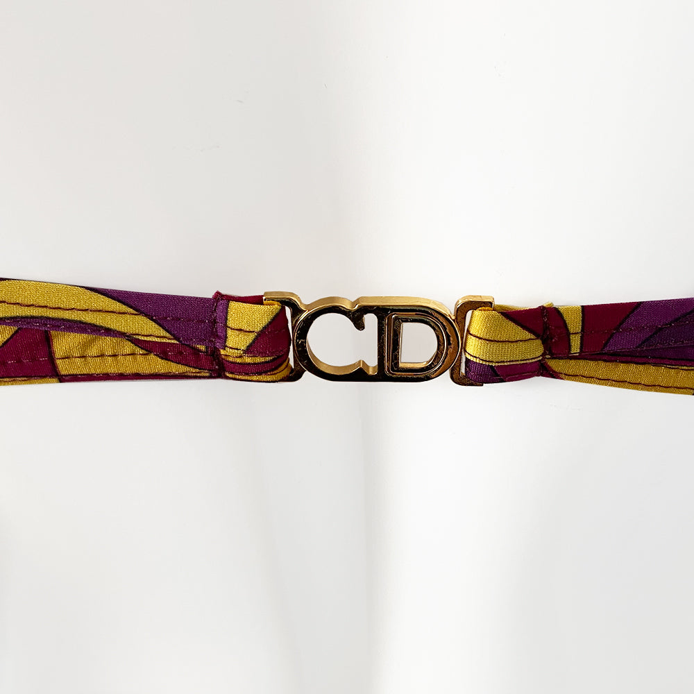 Christian Dior Purple and Yellow CD Logo Bikini with mid rise bottoms and all over modern CD logo print in purple and yellow. Molded bra cups with underwire Gold CD logo clasp closure in back, non-adjustable stretch straps. Made in France