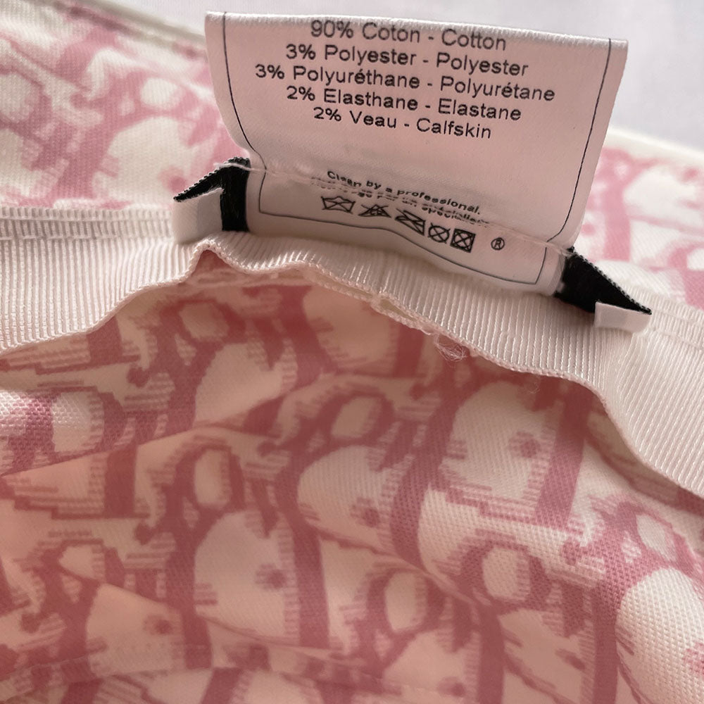 Unused Christian Dior pink monogram Girly collection bucket hat by John Galliano for Dior, spring 2004 adorned with flowers, pearls, Swarovski crystal Dior logo on brim and surrounding leather No 1 in front, patent leather piping. Made in France