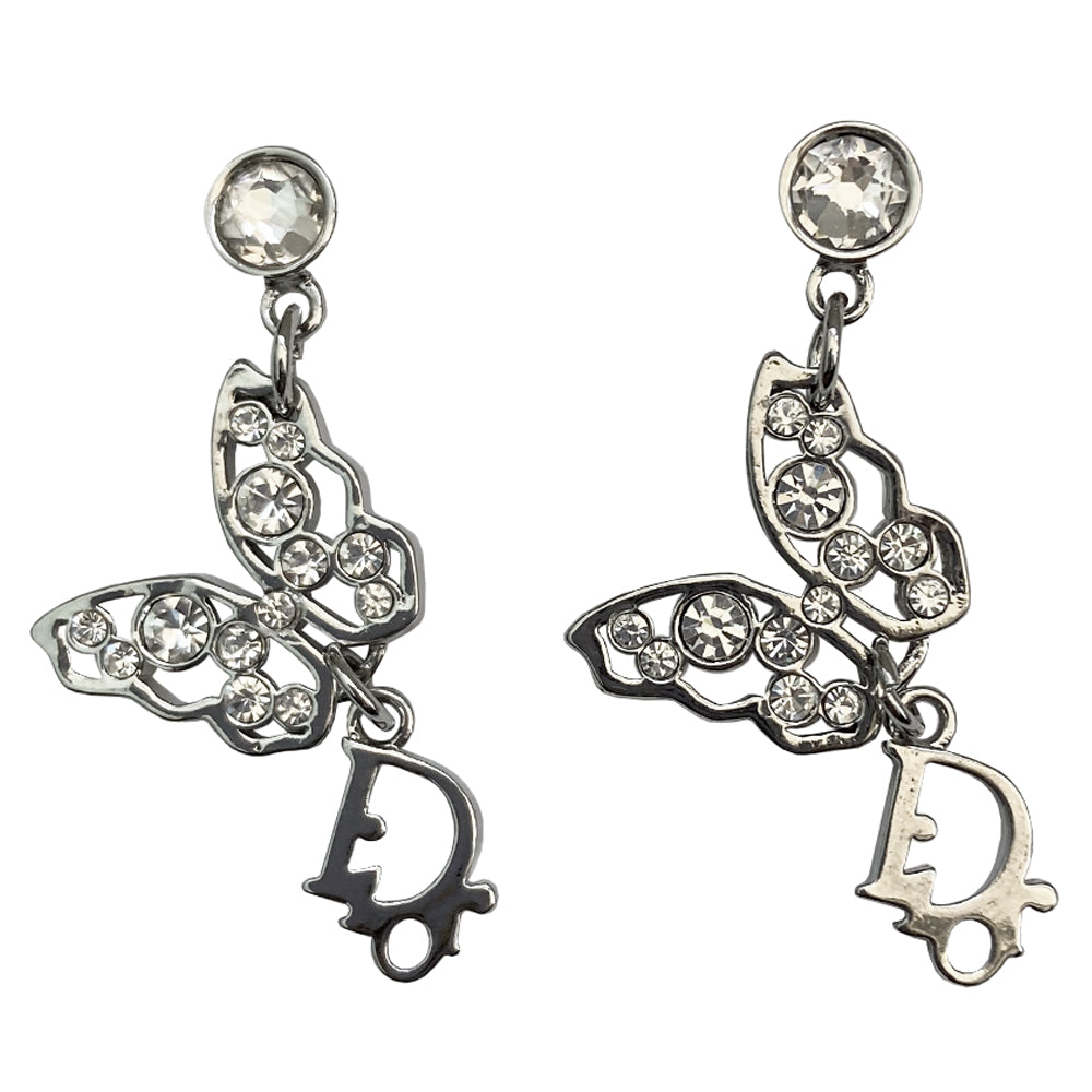 Christian Dior crystal butterfly earrings circa 2005 White crystals set in silver-tone metal clutch back closure earrings Crystal post attached to dangling crystal embellished butterfly with silver-tone Dior logo dangling below