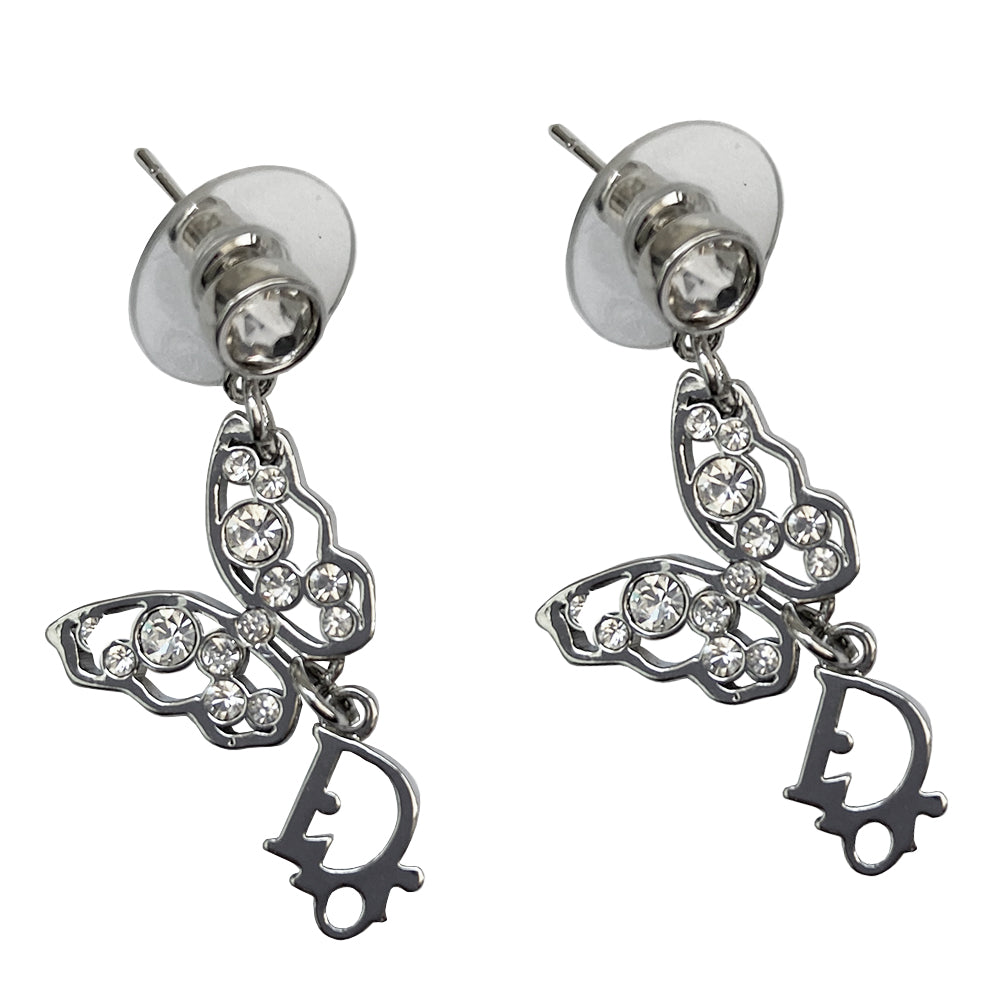 Christian Dior crystal butterfly earrings circa 2005 White crystals set in silver-tone metal clutch back closure earrings Crystal post attached to dangling crystal embellished butterfly with silver-tone Dior logo dangling below