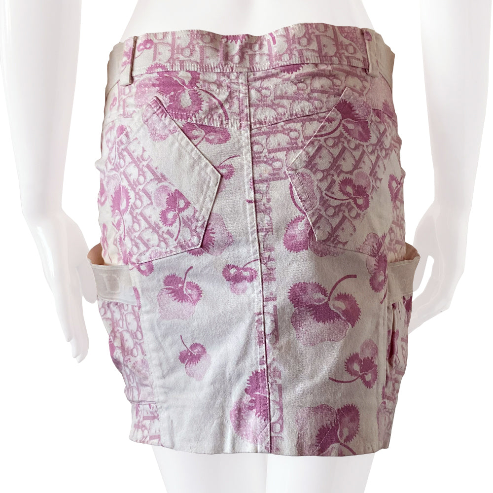 Christian Dior pink cherry blossom skirt by John Galliano for Dior circa 2004 from Logo Flowers Collection. Panelled skirt with belt loops, Dior logo elastic details. Front zipper closure with silver-tone logo button closure and embellished with front logo silver-tone zipper detail, 2 large side wrap around patch pockets.