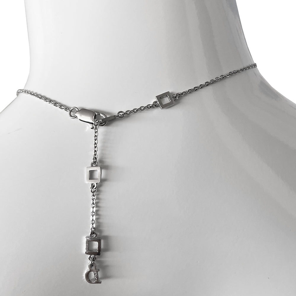 Christian Dior logo letters choker with 3 styles of draped chains and crystal embellished letters that spell Dior. Lobster back closure with 4 length adjustment loops and small hanging logo stamped D charm in back.