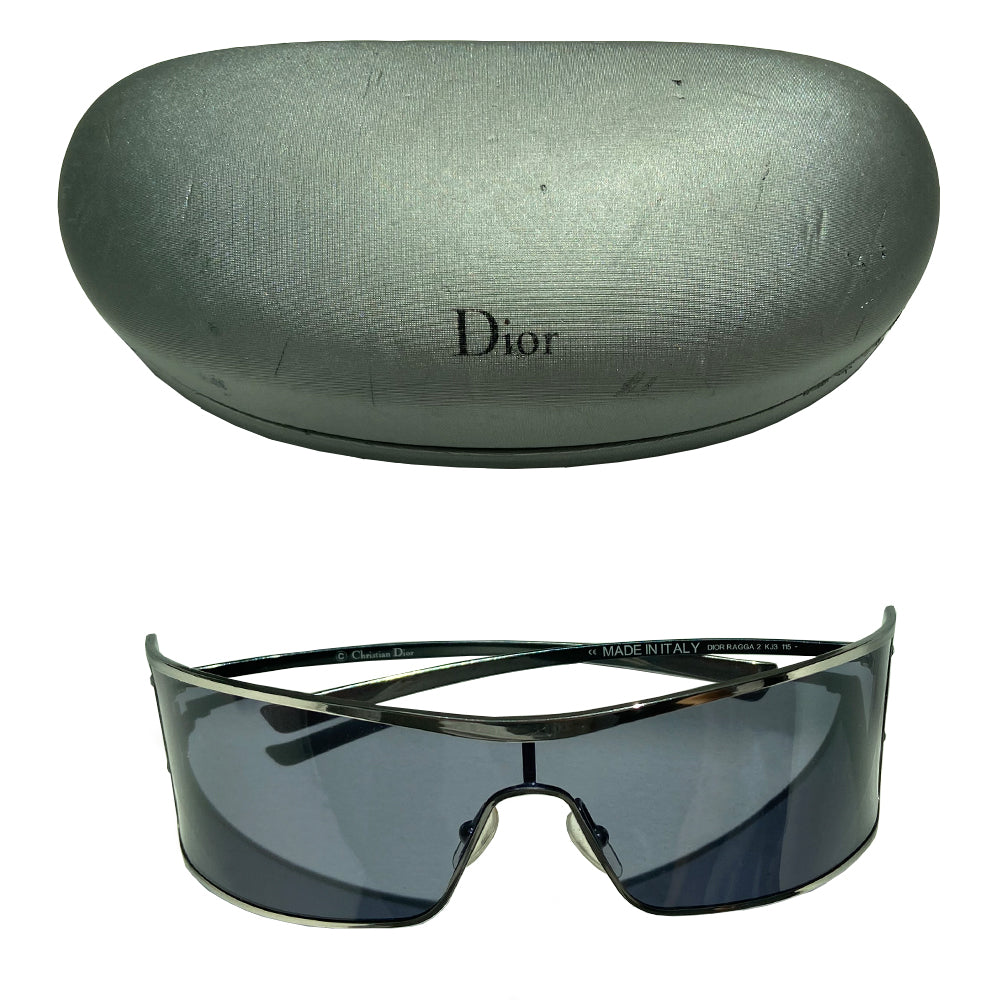 Christian Dior Ragga 2 sunglasses with wrap around silver-tone chrome style frames and arms with grey lens. Embossed Dior logo between 2 screws at each outer frame edge Style: Ragga 2 KJ3 115. Case included. Excellent condition with no scratches on glasses, case in fair condition. Made in Italy