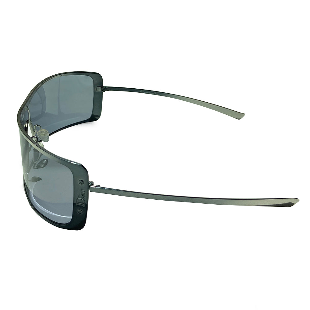 Christian Dior Ragga 2 sunglasses with wrap around silver-tone chrome style frames and arms with grey lens. Embossed Dior logo between 2 screws at each outer frame edge Style: Ragga 2 KJ3 115. Case included. Excellent condition with no scratches on glasses, case in fair condition. Made in Italy