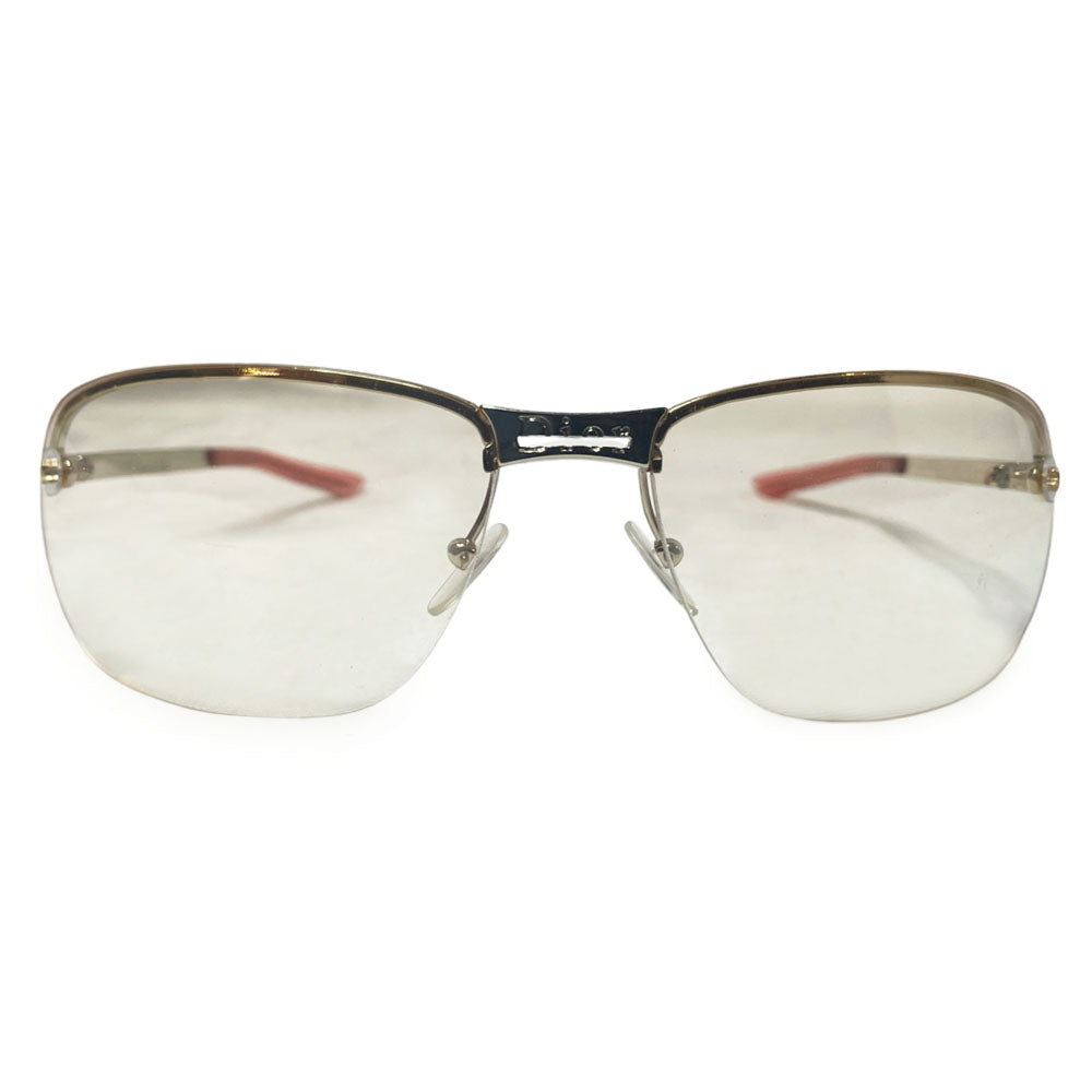Christian Dior Adiorable 5 clear frameless sunglasses with Curved lens metal frame across upper lens and frameless on the bottom. Gold-tone metal frame with clear blush tinted lenses, Dior engraved logo at nose bridge, star screws at lens outer edges. Style: 3YJIG. Made in Italy