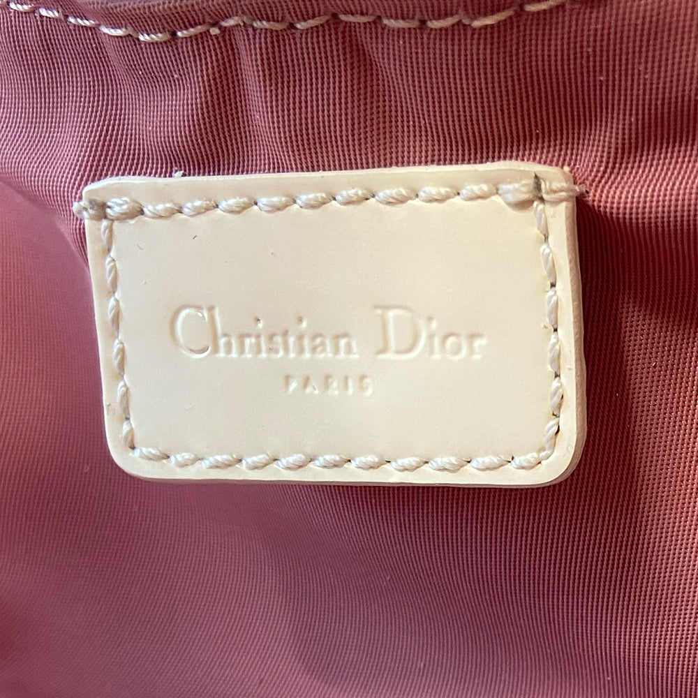 Christian Dior pink monogram Rain bowler bag by John Galliano for Dior, 2004 with transparent vinyl and canvas body, 2 rolled white patent handles and piping, silver-tone hardware, domed bottom feet. Dual zippers opening, roomy pink textile partial lining. Includes pink monogram removable interior pouch. Made in Italy