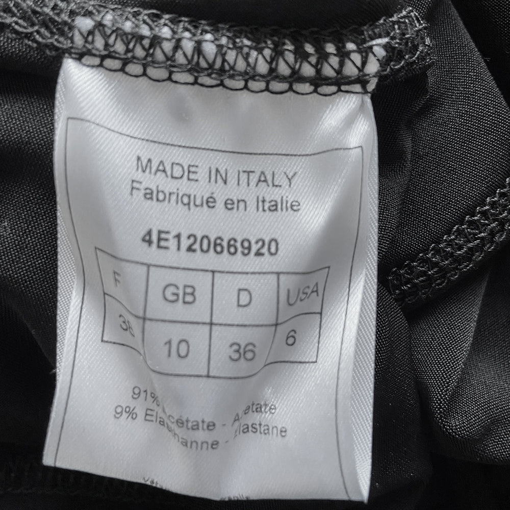 Christian Dior black corset halter dress by John Galliano for Dior, summer 2004. Dior engraved buckle and star adornment on adjustable halter strap attached to laced grommeted bustier, laced grommets at sides, back zipper closure. Made in France