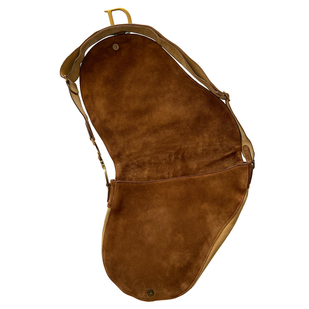 Christian Dior brown, tan, cream pony and suede saddle bag by John Galliano for Dior, 2002. Embossed leather and pony flap with suede front accent, body and shoulder strap, antique brass-tone logo engraved hardware, rear slip pocket, interior jacquard logo lining, zip pocket.