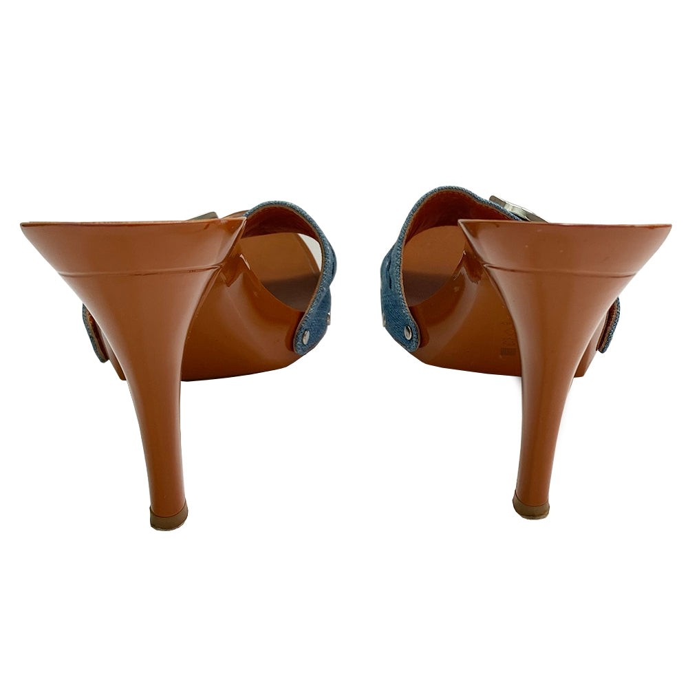 Christian Dior light denim open toe butterfly embroidered slide heels. Denim upper with embroidered butterfly on each shoe in 3 shades of blue, high gloss caramel color platform and soles with embossed rubber grips. Silver-tone logo initial on each shoe, with silver-tone stud attachments at sides. Made in Italy