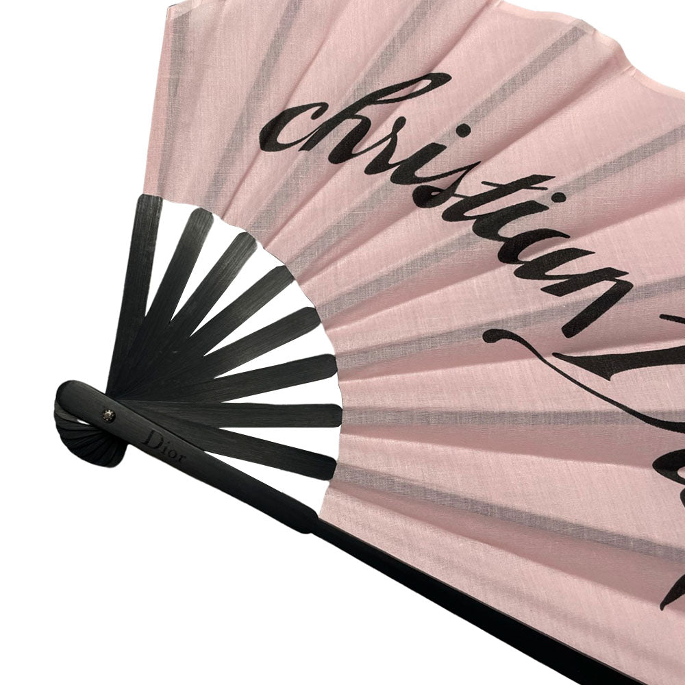 Christian Dior Folding Hand Fan Christian Dior logo printed stiff fabric Dior hand fan in pink with black bamboo. Made in France