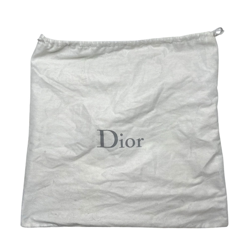 John Galliano for Dior, 2004 navy monogram denim cap with orange contrast stitching, orange band, calf leather accent trim, orange rubber Dior logo hanging tag attached. Grosgrain interior ribbon, lined in navy nylon. Made in France