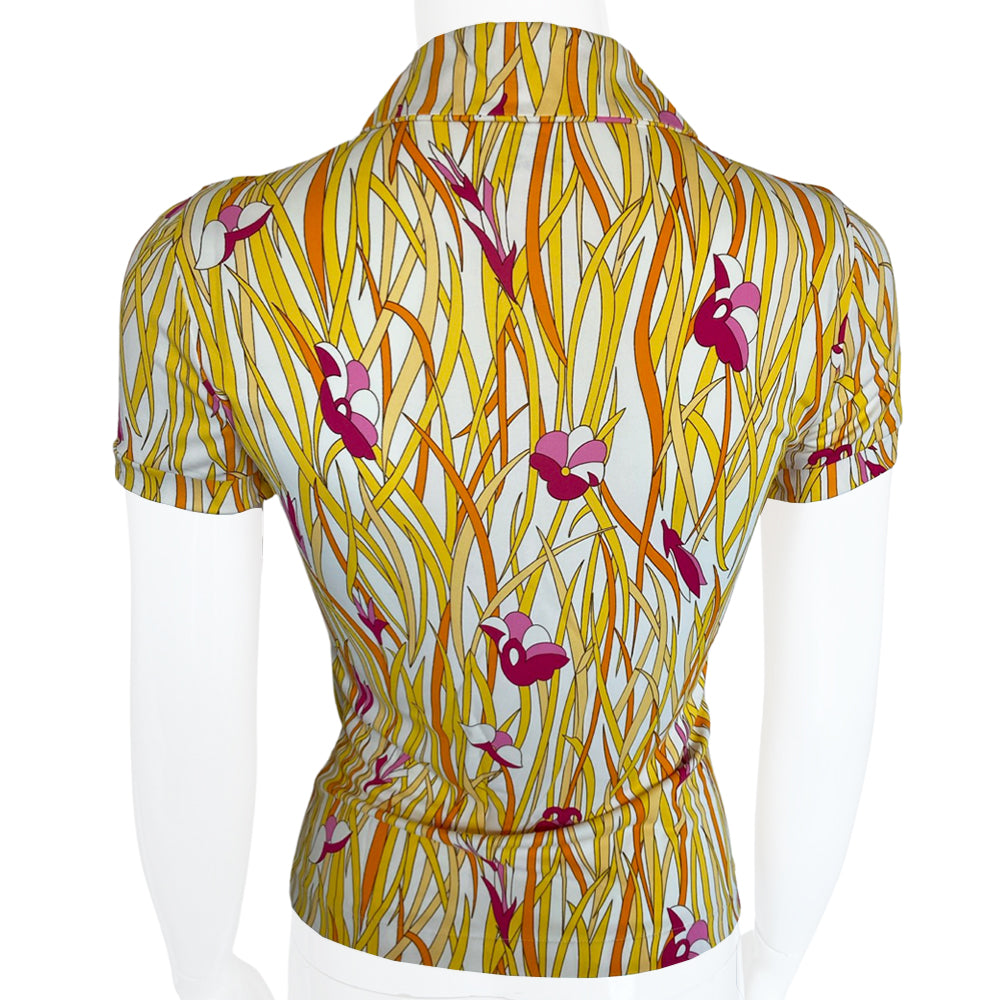 Christian Dior polo top by John Galliano for Dior, spring 2002 with all over long golden yellow intertwined leaf pattern and pink flowers. Open deep V neck with tie cord at neck. Made in France