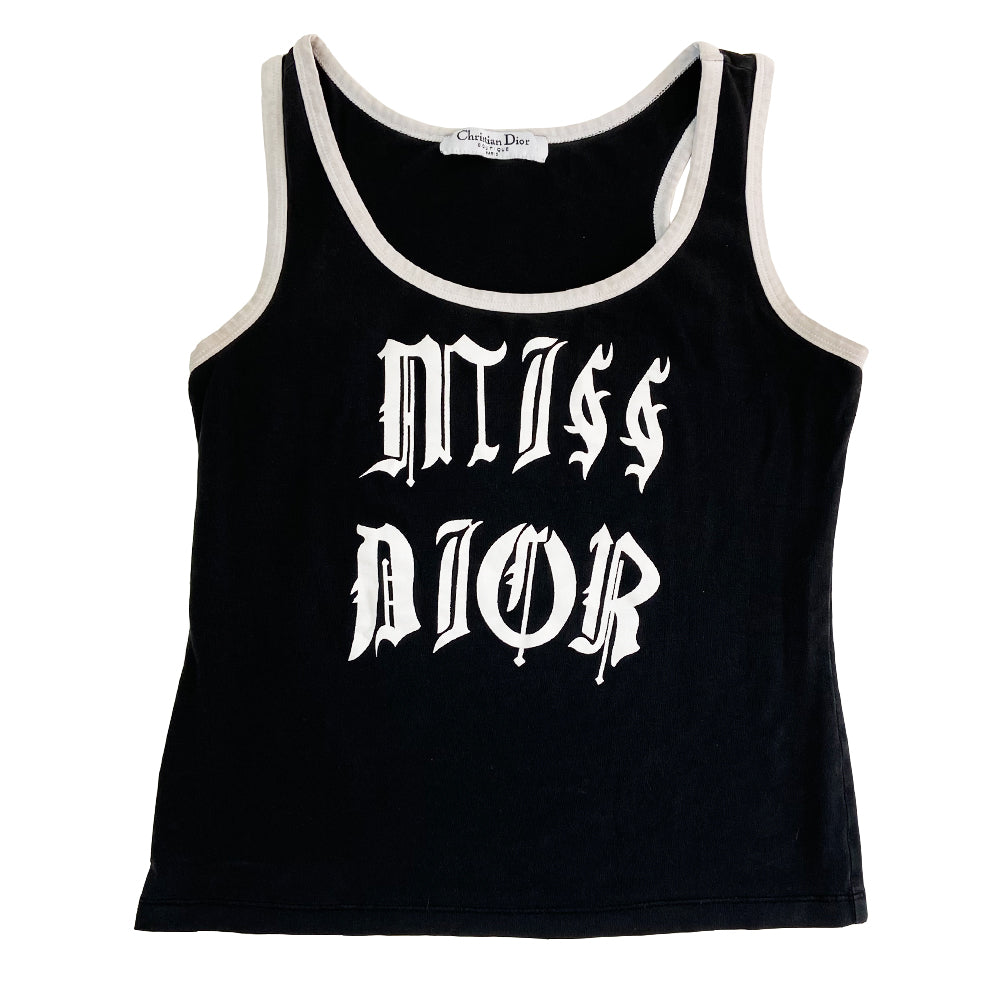 Christian Dior rare Gothic Script Tank circa 2002 by John Galliano for Dior Super soft stretch fabric with piping at neckline and arm holes. Color: Black with white script lettering and accent. Fabric: 95% Cotton, 5% Lycra Made in Italy Missing size tag Nape of Neck to Bottom Hem (in) 18.5" Chest approx (in) 16"