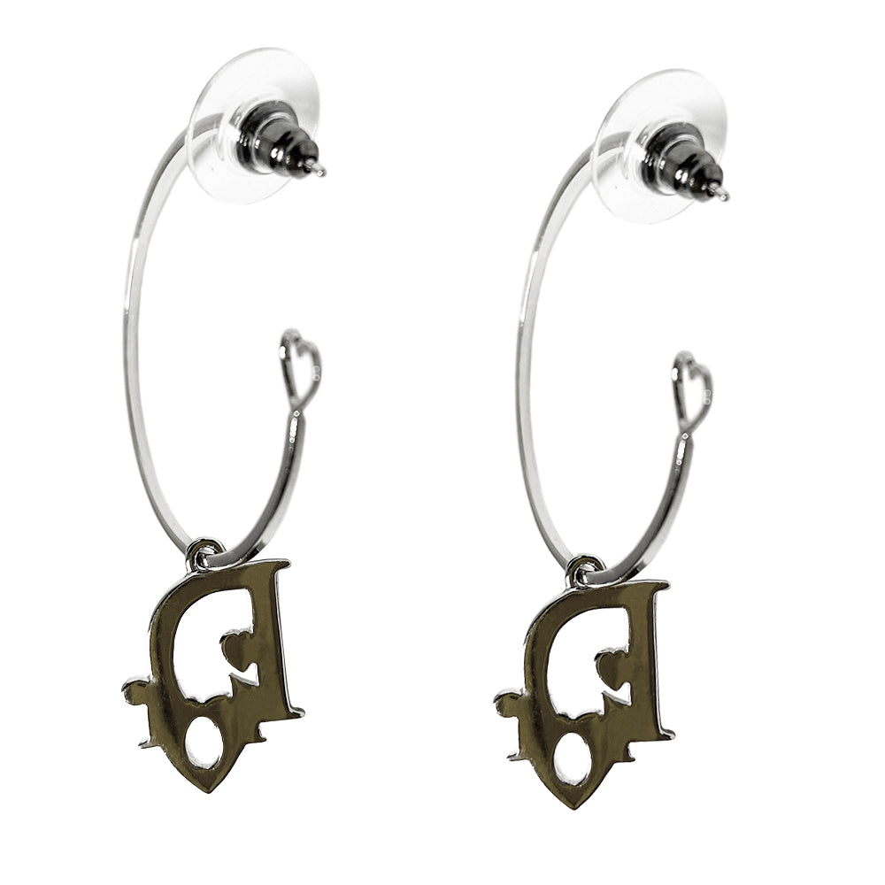 Christian Dior silver-tone logo hoop earrings with, open heart design at one end, dangling Dior logo feature with blue ombre accent. Clutch back closure.