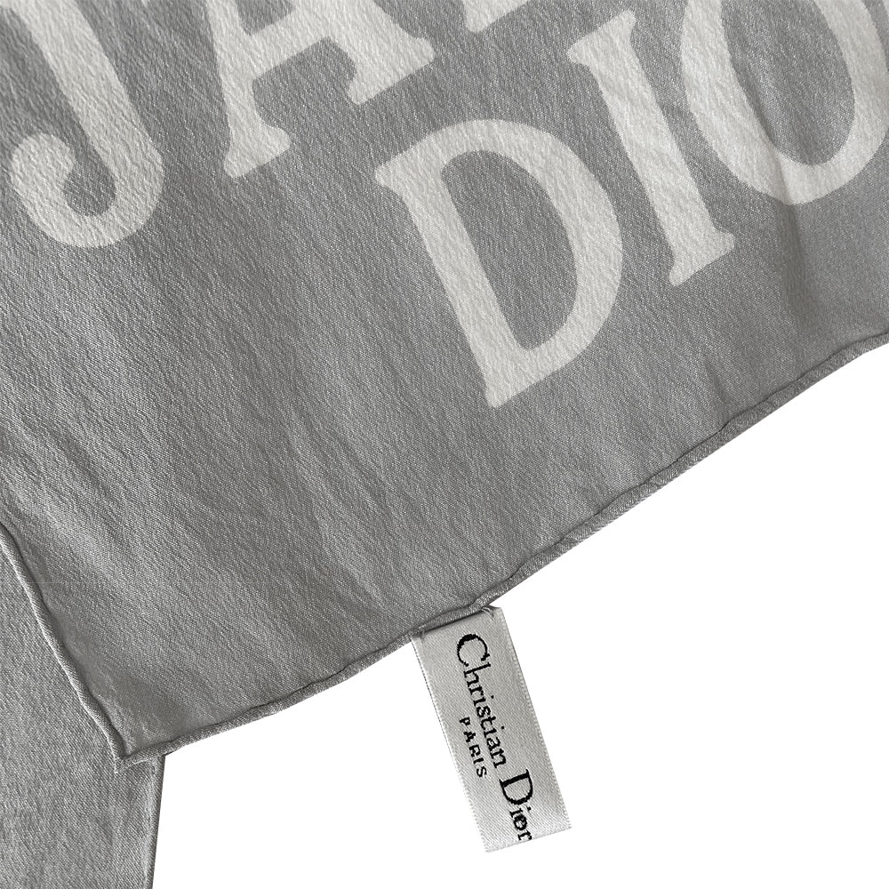 Christian Dior J’Adore Dior long rectangular silk pale grey scarf with white logo printed at each end and hand rolled edges. Made in Italy