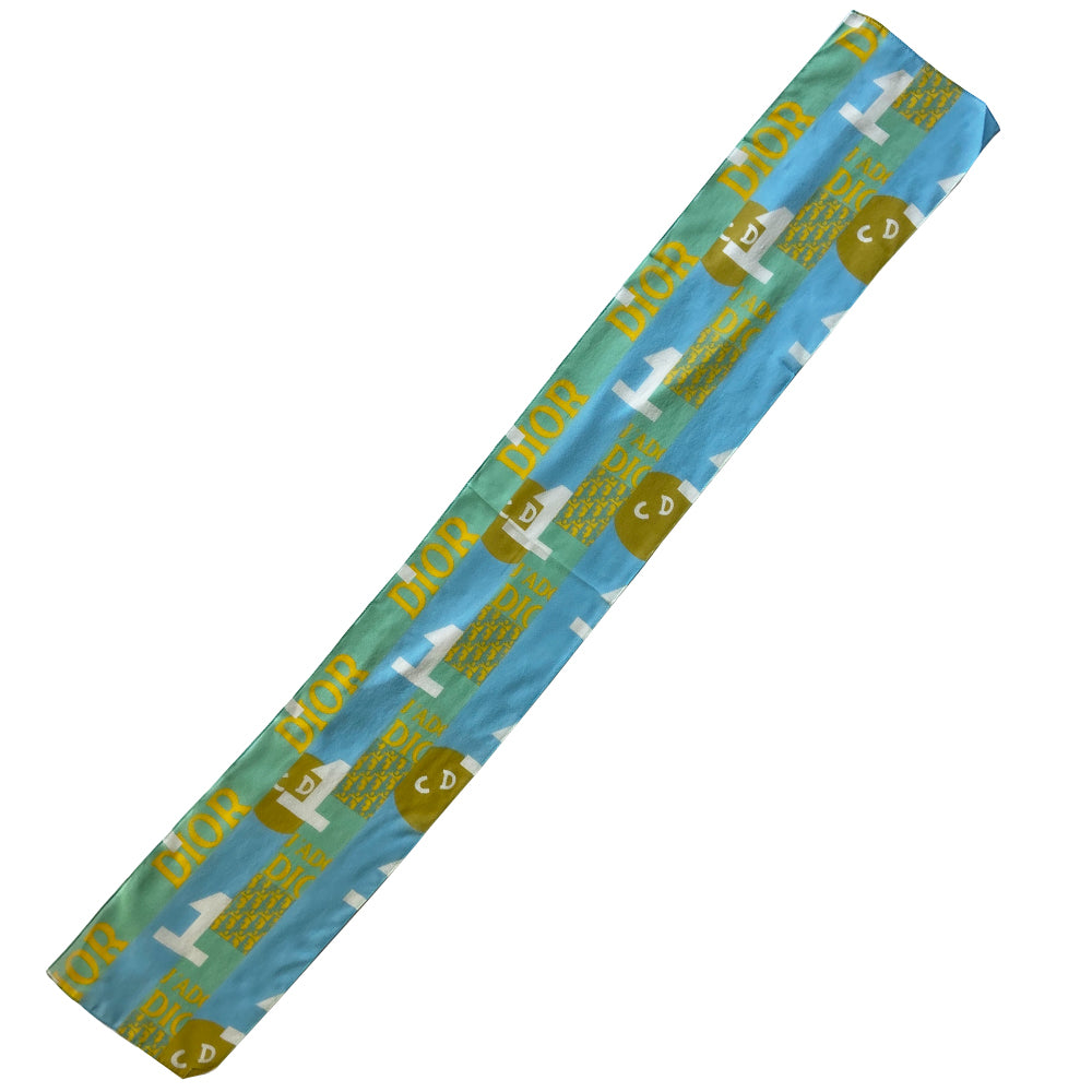 Christian Dior J’Adore Dior blue, yellow, green rectangular silk scarf by John Galliano for Dior, spring 2005 featuring a patchwork of iconic John Galliano for Dior logo designs through the years. Made in Italy