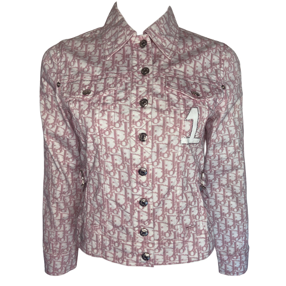 Christian Dior pink monogram Girly button up denim jacket by John Galliano for Dior, spring 2004 with 2 front flap pockets at chest and No 1 surrounded by Swarovski crystals. Silver-tone logo buttons and engraved logo buckle details on adjustable side straps, Dior crystal logo at one sleeve cuff. Made in Portugal