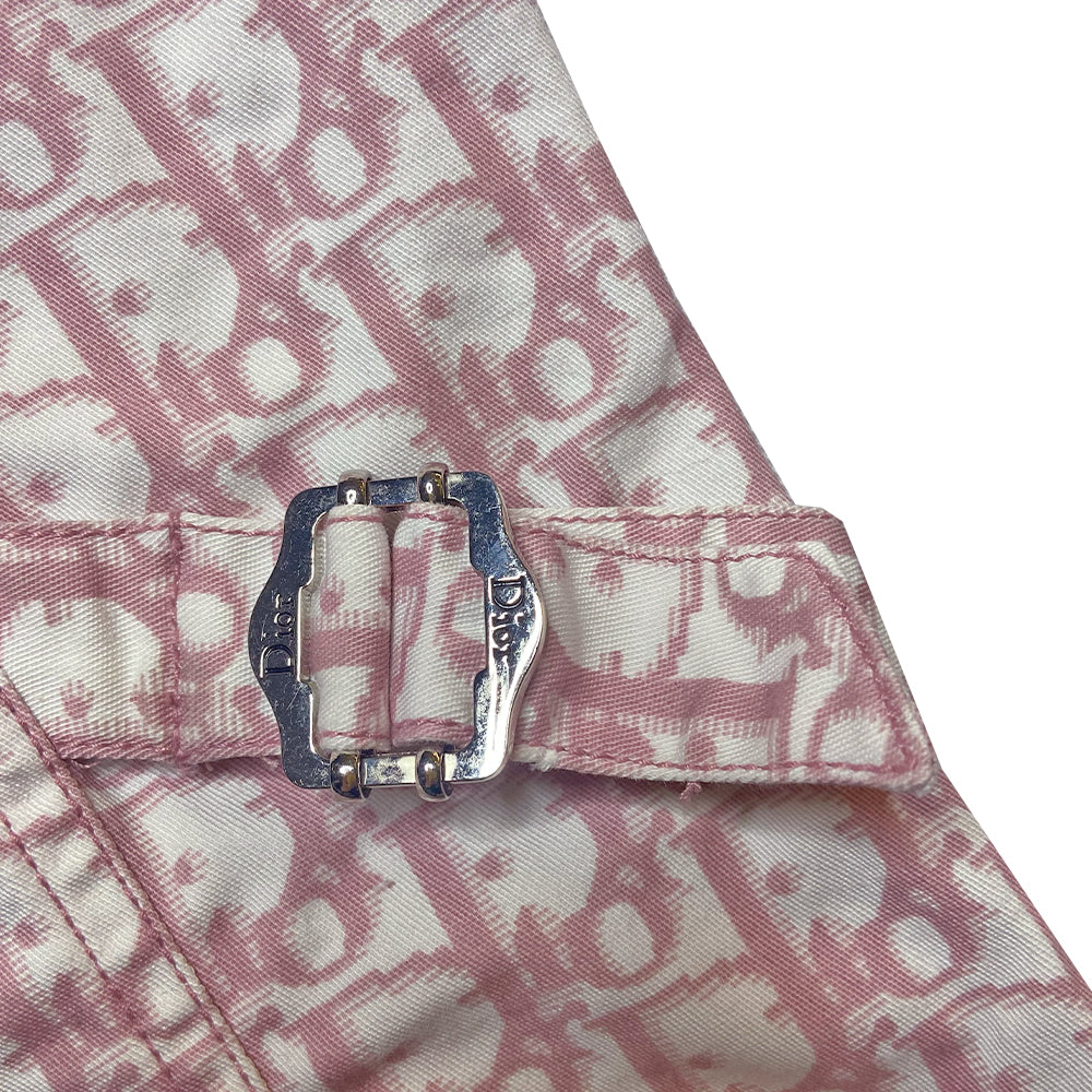 Christian Dior pink monogram Girly button up denim jacket by John Galliano for Dior, spring 2004 with 2 front flap pockets at chest and No 1 surrounded by Swarovski crystals. Silver-tone logo buttons and engraved logo buckle details on adjustable side straps, Dior crystal logo at one sleeve cuff. Made in Portugal