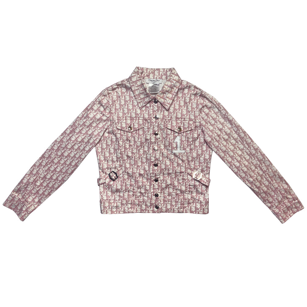 Christian Dior pink monogram Girly button up denim jacket by John Galliano for Dior, spring 2004 with 2 front flap pockets at chest and No 1 surrounded by Swarovski crystals. Silver-tone logo buttons and engraved logo buckle details on adjustable side straps, Dior crystal logo at one sleeve cuff. Made in Portugal