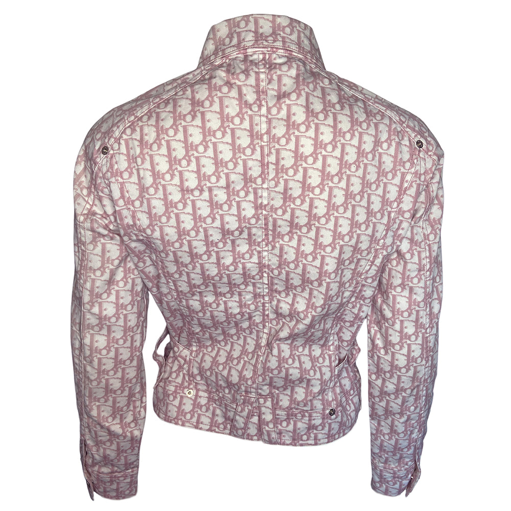 Christian Dior pink monogram Girly button up denim jacket by John Galliano for Dior, spring 2004 with 2 front flap pockets at chest and No 1 surrounded by Swarovski crystals. Silver-tone logo buttons and engraved logo buckle details on adjustable side straps, Dior crystal logo at one sleeve cuff. Made in Portugal