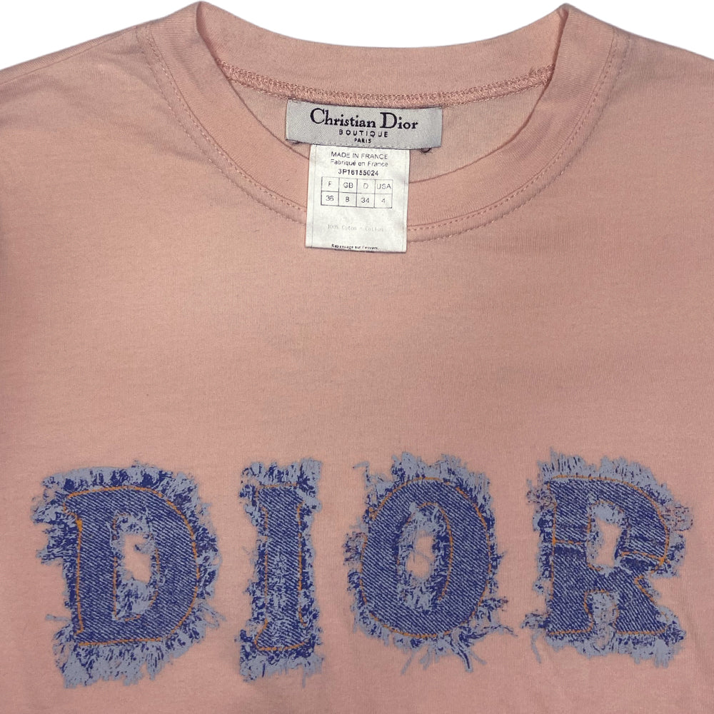 Christian Dior short sleeve blush pink tee by John Galliano for Dior, spring 2003 with ribbed crew neck and trompe l’oeil frayed faded denim DIOR logo letters. Made in France