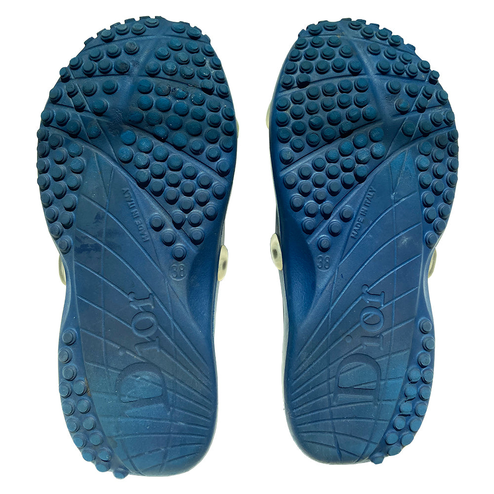 Christian Dior navy blue and white monogram jelly pool slides from John Galliano early 2000’s era. Clear upper with Dior logo embossing and perforated air holes. Monogram insole with clear nubby overlay for added comfort. Rubber bottom sole with grippy nubs and Dior logo imprint. Made in Italy