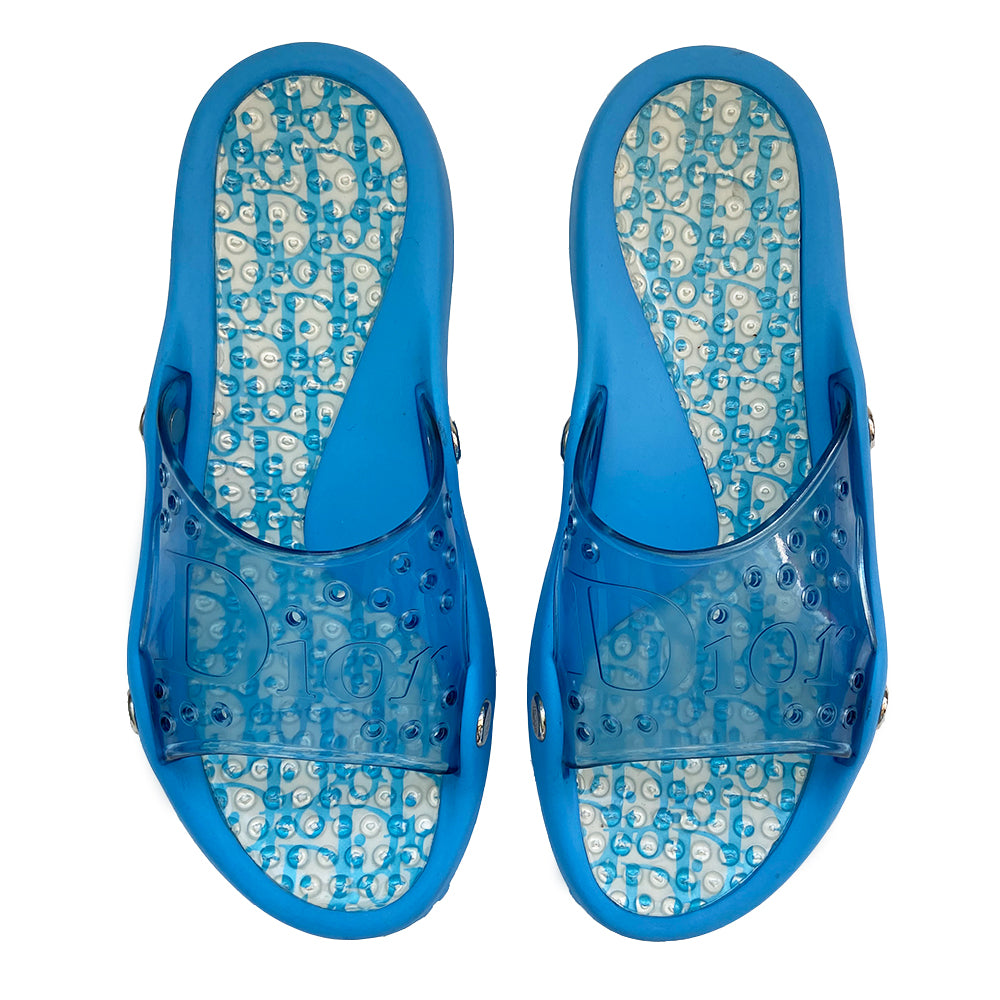 Christian Dior Monogram Jelly Slides from John Galliano era with clear blue upper and embossed Dior logo, perforated air holes, dior logo silver studs along sides. Monogram insoles have clear nubby overlay for extra comfort. Rubber soles have grippy nubs, Dior logo. Main Color: Blue Excellent condition Size: IT 42. Made in Italy