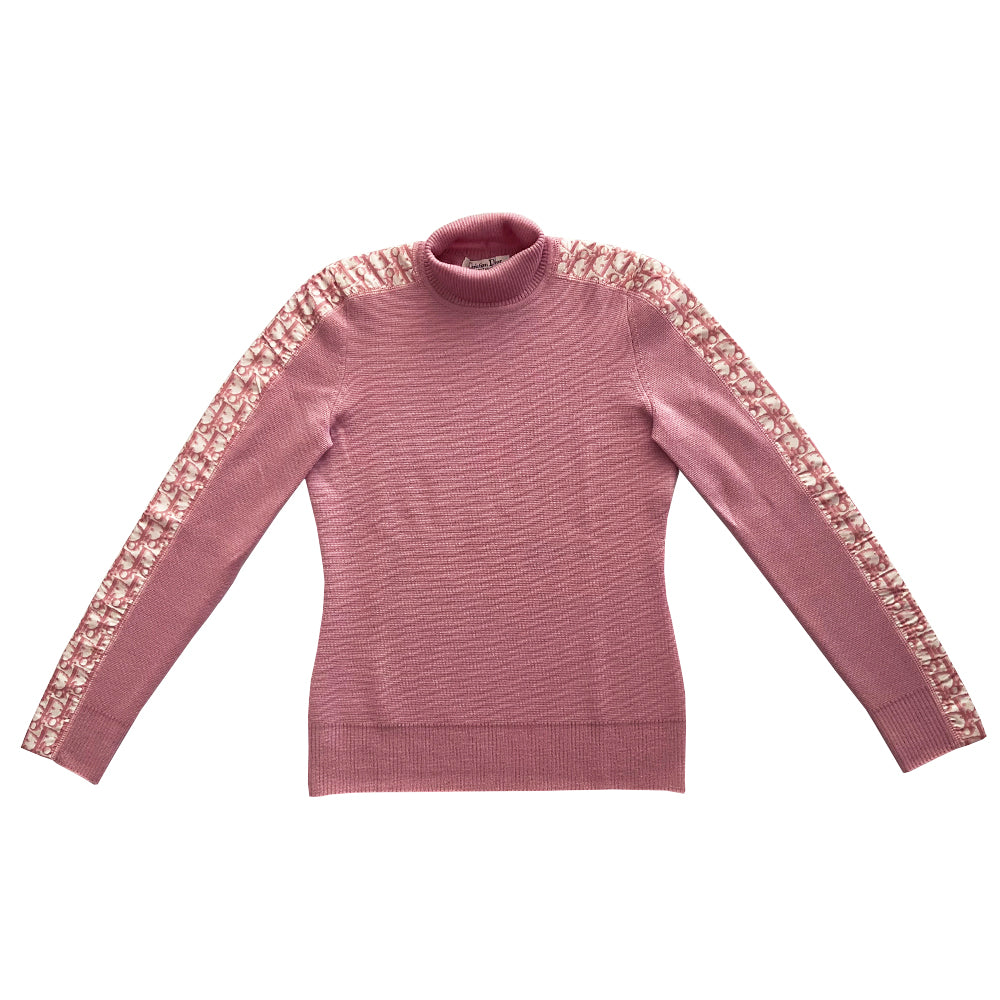 Christian Dior turtleneck pink wool sweater from John Galliano for Christian Dior, winter 2004 with ribbed turtleneck and cuffs, pink Diorissimo accent stripe on sleeves from cuff to neck. Size 38. Made in Italy