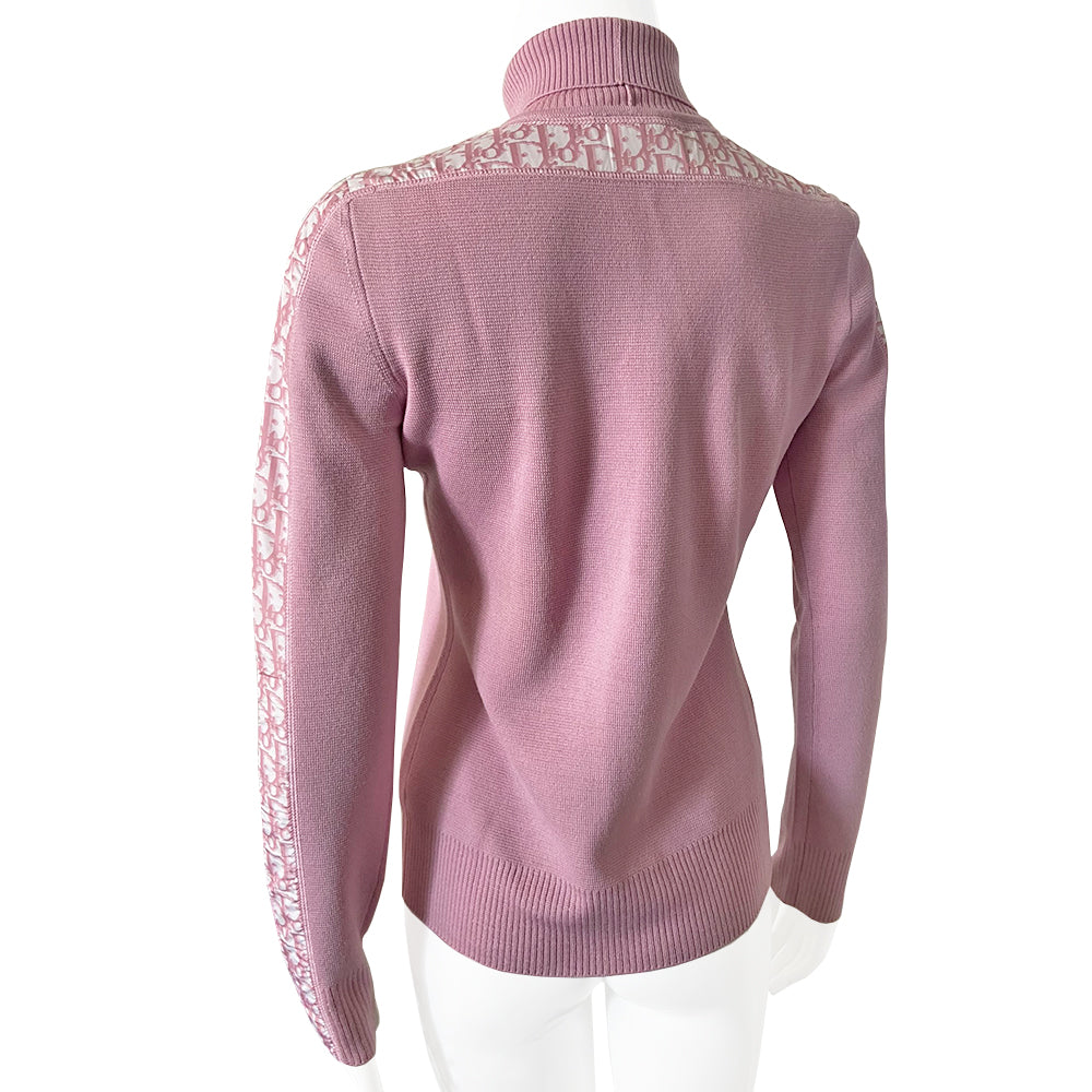 Christian Dior turtleneck pink wool sweater from John Galliano for Christian Dior, winter 2004 with ribbed turtleneck and cuffs, pink Diorissimo accent stripe on sleeves from cuff to neck. Size 38. Made in Italy