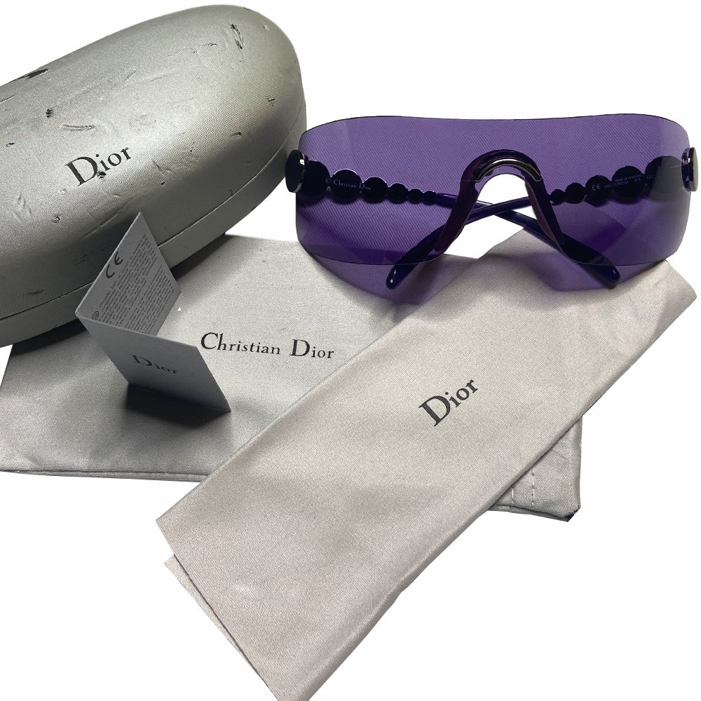 Christian Dior Millennium sunglasses from 2001 with frameless purple lenses with gunmetal-tone hardware Dior logo engraved on arms. Included: Original hang tag, cleaning cloth, fabric duster, hard case. Made in Austria