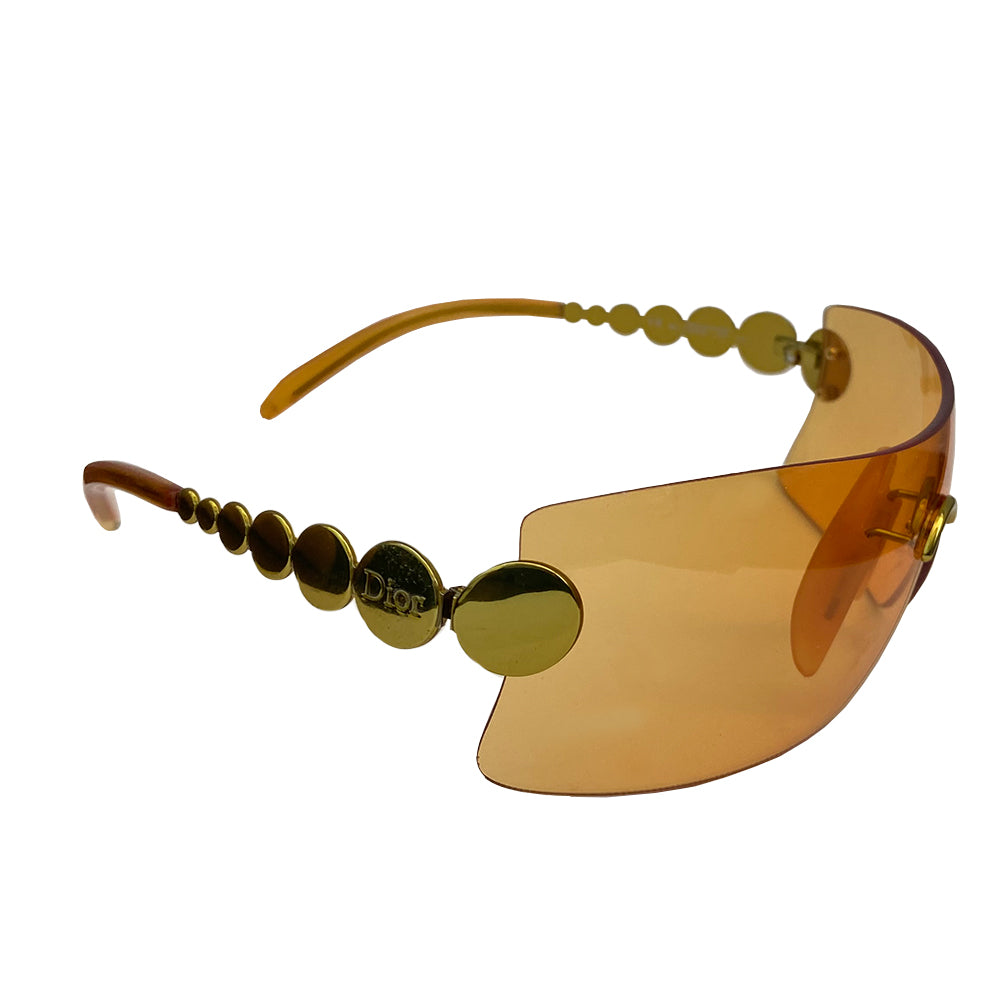 Christian Dior orange millennium sunglasses from 2001. Oversized shield lens with gold-tone hardware Dior logo engraved on arms. Excellent condition with no scratches on lens. Made in Austria.