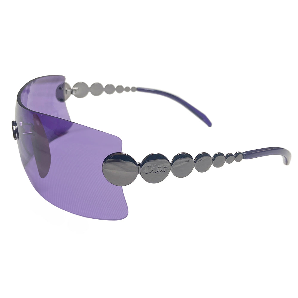 Christian Dior Millennium sunglasses from 2001 with frameless purple lenses with gunmetal-tone hardware Dior logo engraved on arms. Included: Original hang tag, cleaning cloth, fabric duster, hard case. Made in Austria