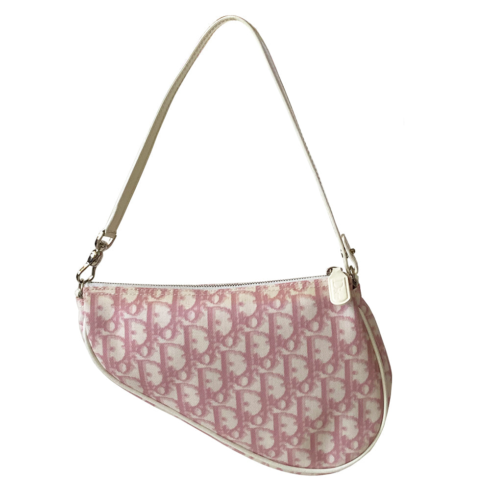 Christian Dior pink diorissimo canvas mini saddle bag by John Galliano for Dior, 2004.th White leather piping and strap, silver-tone hardware. Top zipper closure with Dior embossed leather zipper pull, pink textile interior. Made in Spain