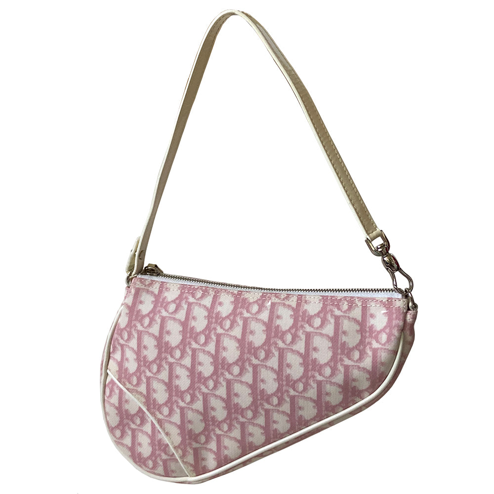 Christian Dior pink diorissimo canvas mini saddle bag by John Galliano for Dior, 2004.th White leather piping and strap, silver-tone hardware. Top zipper closure with Dior embossed leather zipper pull, pink textile interior. Made in Spain